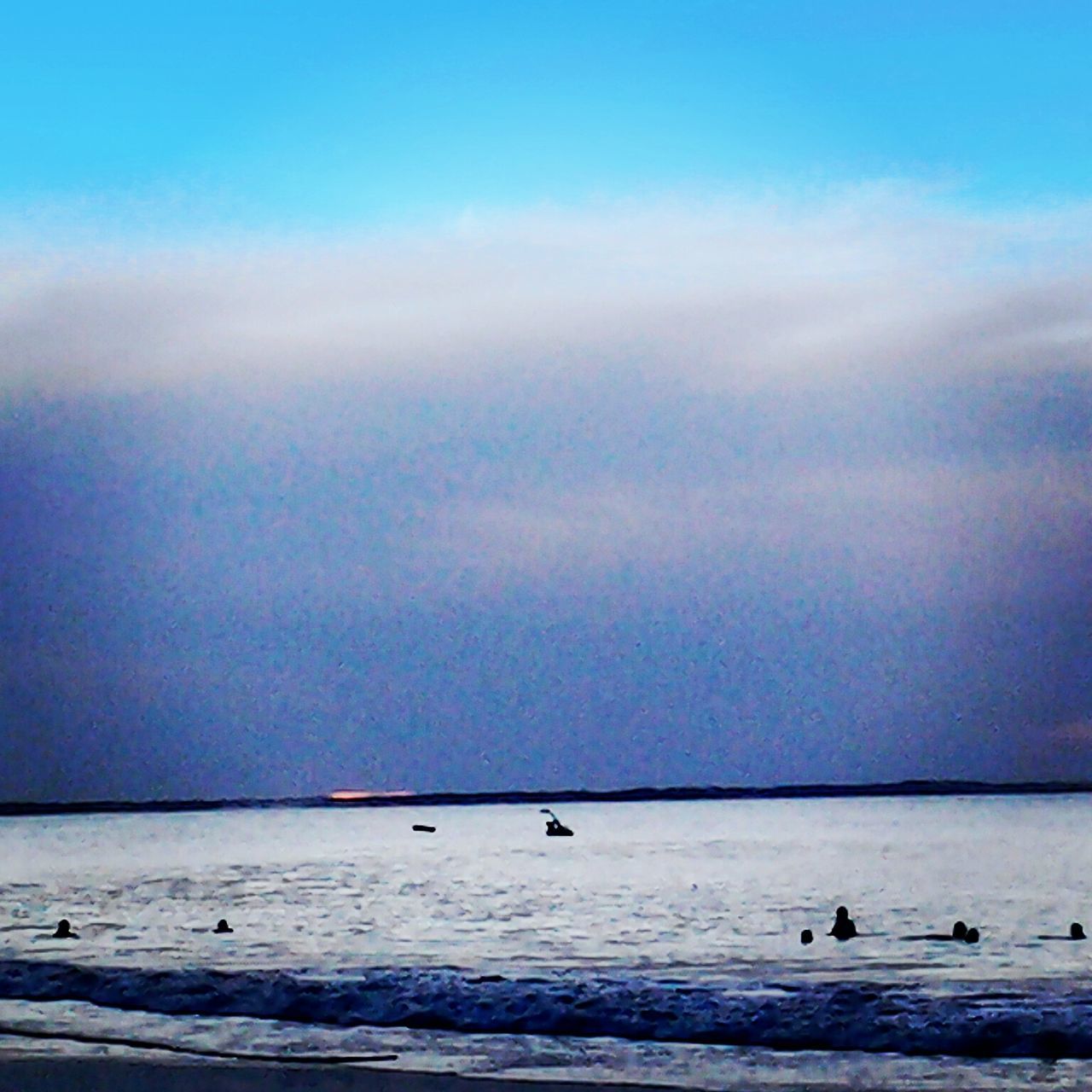 sea, water, horizon over water, bird, scenics, tranquil scene, sky, tranquility, beauty in nature, nature, blue, animal themes, beach, idyllic, cloud - sky, waterfront, flying, wildlife, animals in the wild, dusk