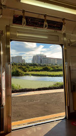 Scenic view of river seen through window