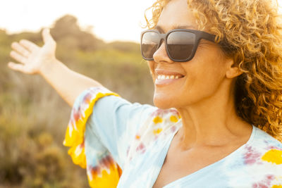 Portrait of young woman wearing sunglasses