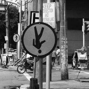 Road sign on street in city