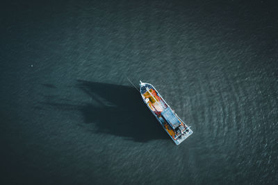 High angle view of boat sailing on sea