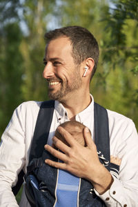 Mid adult man standing outdoors