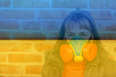 Ukraine war. european blond woman uses a construction respirator as a mask. chemical weapon.