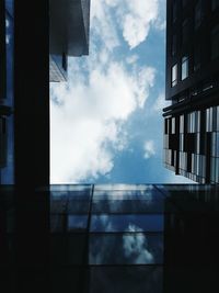 Low angle view of building against cloudy sky