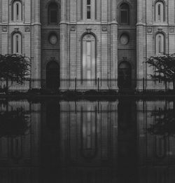 Building by lake with reflection