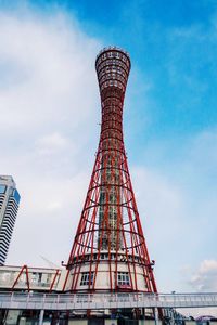 Low angle view of tower against cloudy sky