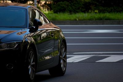 Cropped image of car on road