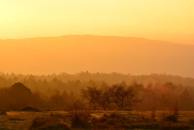 Scenic view of mountains against sky during sunset