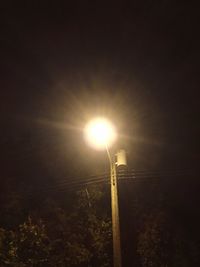 Low angle view of street light against sky