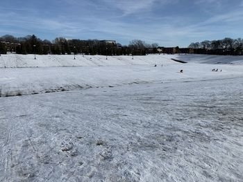 Scenic view of frozen lake against sky