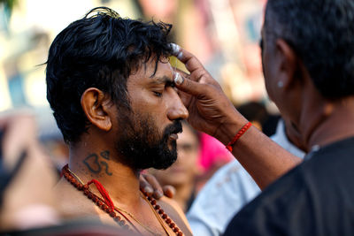 Side view of man with arms raised