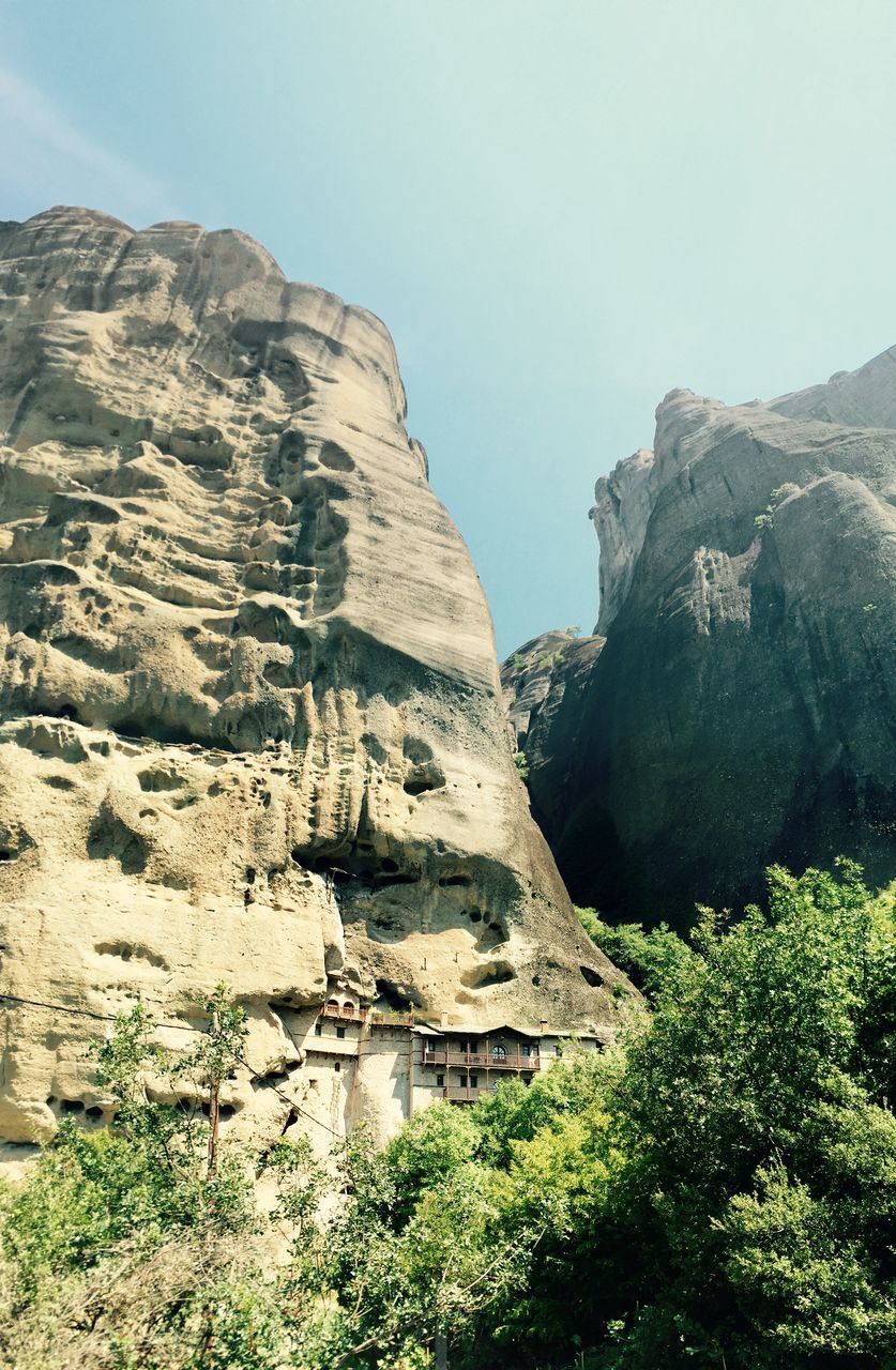 rock formation, rock - object, tranquility, tranquil scene, cliff, scenics, geology, beauty in nature, nature, clear sky, mountain, rock, physical geography, eroded, rocky mountains, non-urban scene, sky, landscape, rough, low angle view