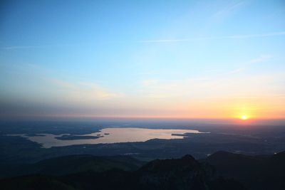 Scenic view of silhouette mountains against sky at sunset