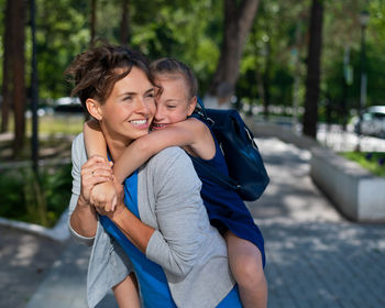 Portrait of smiling young woman outdoors