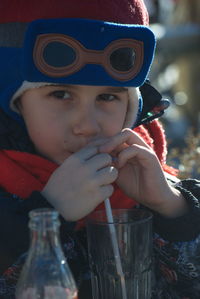 Portrait of boy drinking water