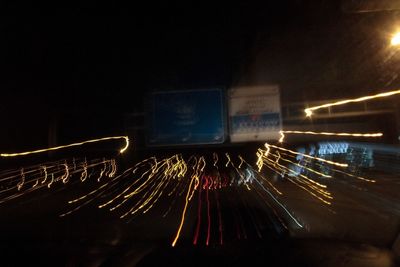 Light trails against sky at night