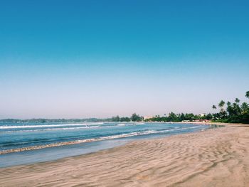 Scenic view of beach against clear sky