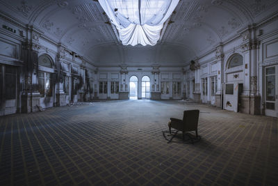 Empty chairs in corridor