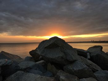 Scenic view of sea against sky at sunset