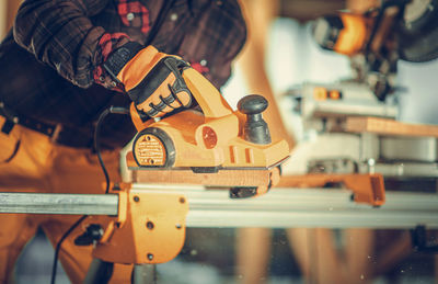 Low section of man working at factory