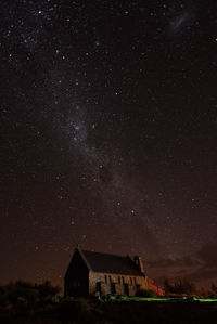 Low angle view of building against sky at night