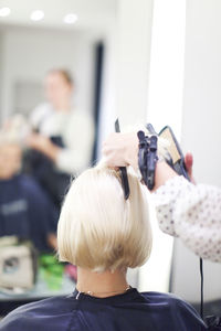 Woman having haircut, stockholm, sweden