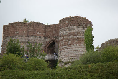Low angle view of old ruins against clear sky