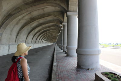 Woman standing in corridor