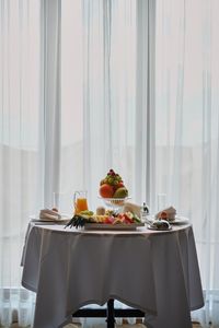 Food served on table against window