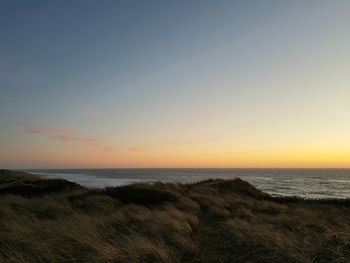 Scenic view of sea against sky during sunset