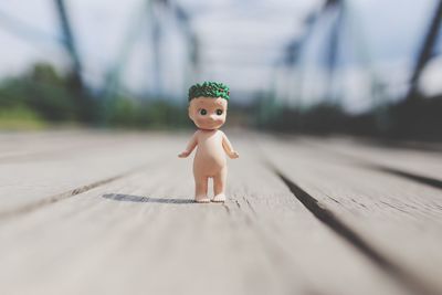 Doll on boardwalk