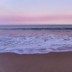 View of beach at sunset