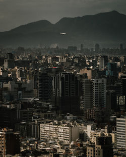 High angle view of buildings in city against sky