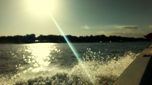 Water splashing against sky