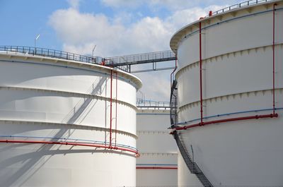 Low angle view of factory against sky