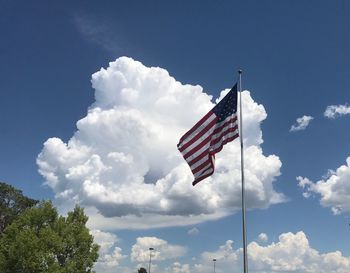 Low angle view of american flag against sky