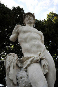 Low angle view of statue against sky