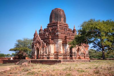 Old temple against clear blue sky