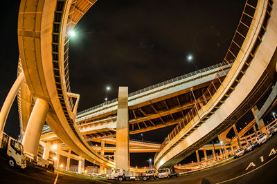 Low angle view of modern buildings in city at night