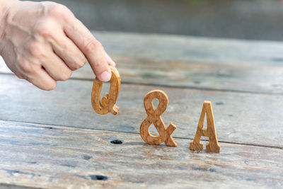 Close-up of hands holding table