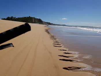 Scenic view of beach against clear sky