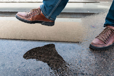 Low section of man standing on floor