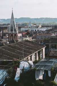 High angle view of buildings in town against sky