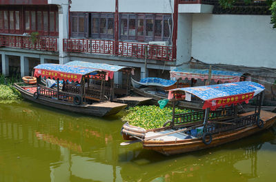 Boats moored in canal