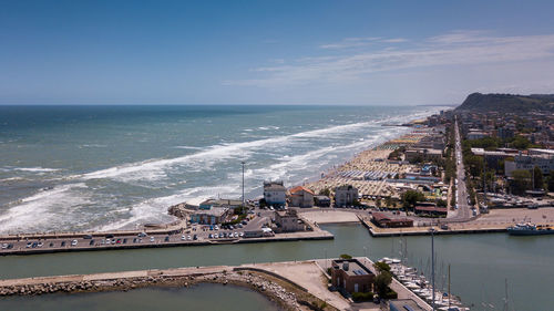 High angle view of swimming pool by sea against sky