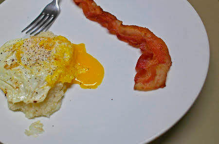 food, food and drink, fried, kitchen utensil, egg, indoors, eating utensil, fried egg, meal, close-up, ready-to-eat, fork, plate, no people, egg yolk, breakfast, meat, freshness, healthy eating, studio shot, sunny side up