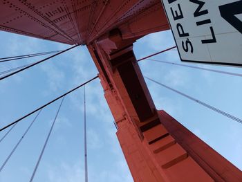 Low angle view of communications tower against sky