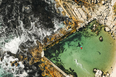 High angle view of rocks by sea