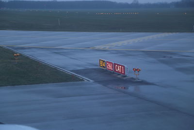 High angle view of signboards on runway during foggy weather