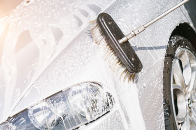 Close-up of reflection of car in water